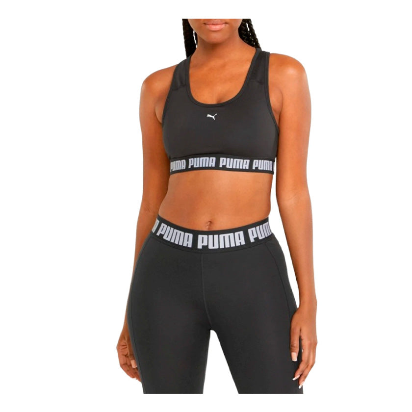 Top Puma Mid Impact Strong Bra 521598 01 para mujer de color negro con blanco de uso para entrenamiento